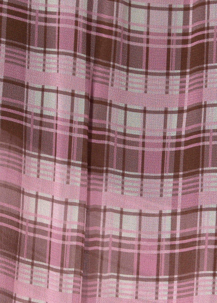 Pantalón largo bombacho de cuadros en rosa con detalles en tonos marrones y blancos