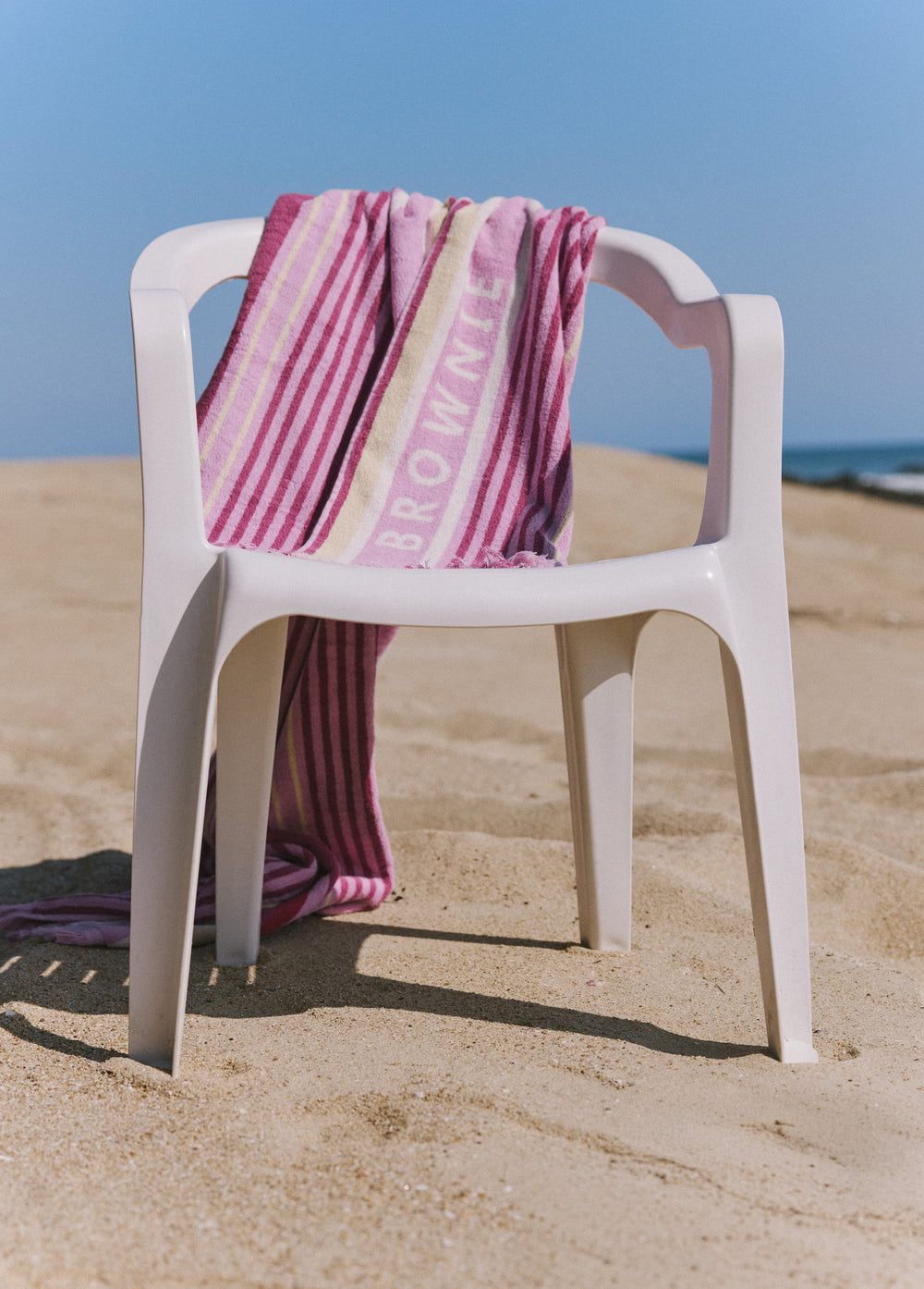 Toalha listrada marrom