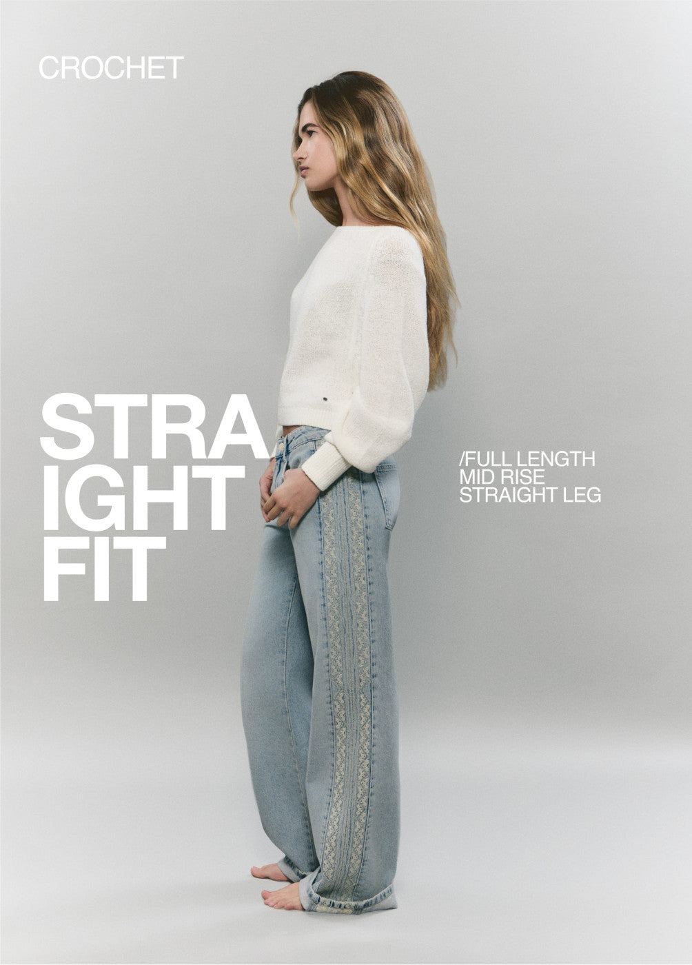 Jeans con pezzo laterale a punto croce