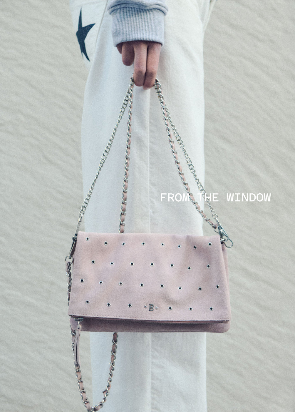 Leather flap bag with eyelets