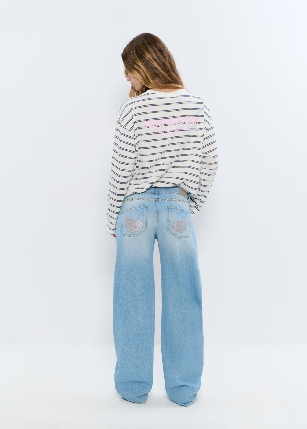 Low-rise glitter wing jeans