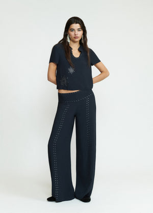 Pantalón largo tachas