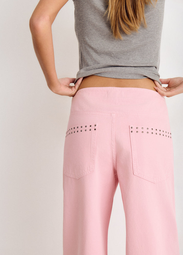 Pantalón pieza cintura con tachas