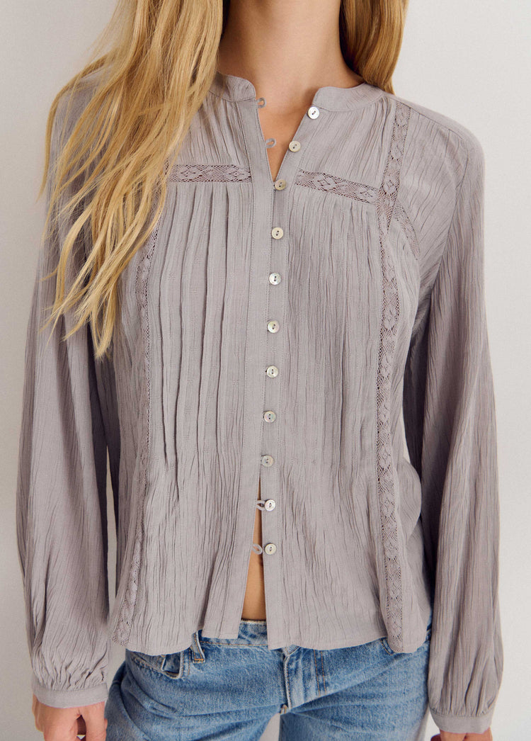 Blusa jaretas encaje manga larga