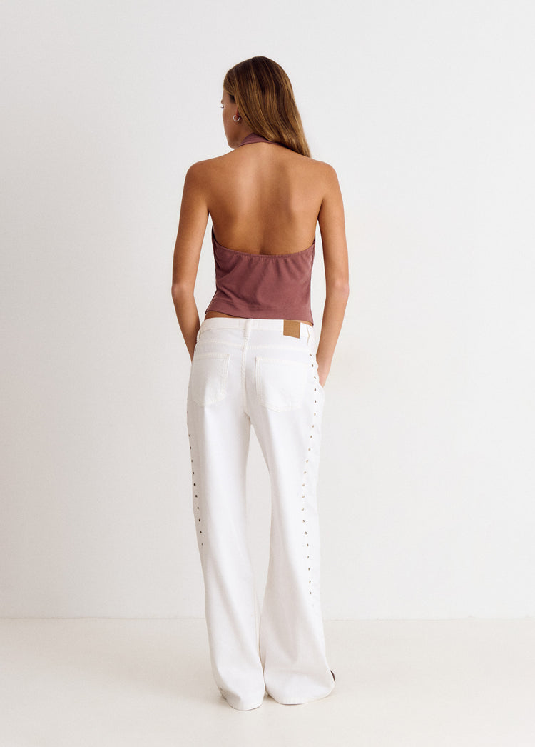 Pantalón pieza lateral tachuelas
