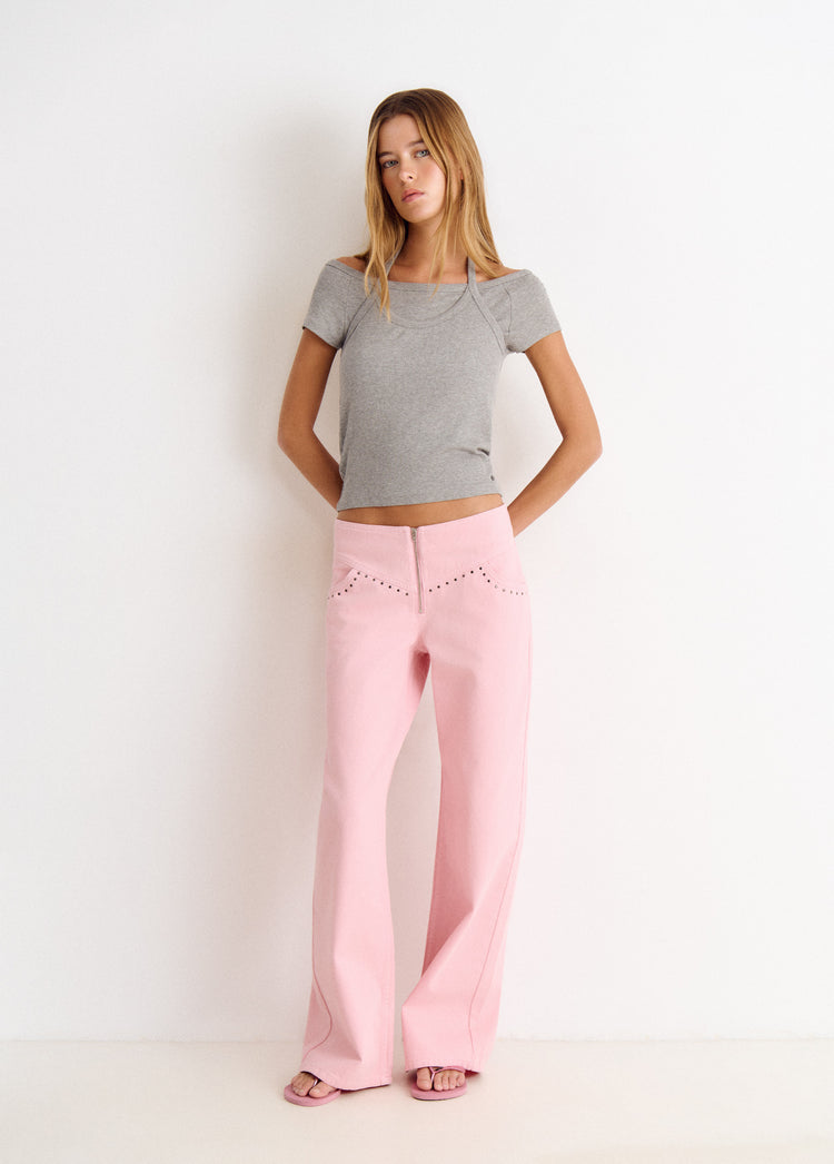 Pantalón pieza cintura con tachas