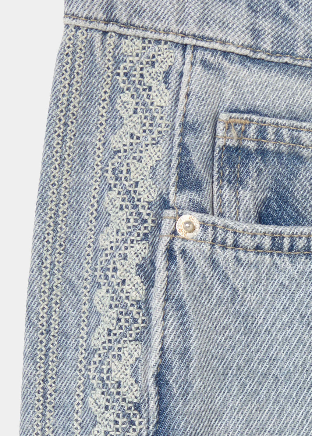 Jeans with side cross-stitch panel