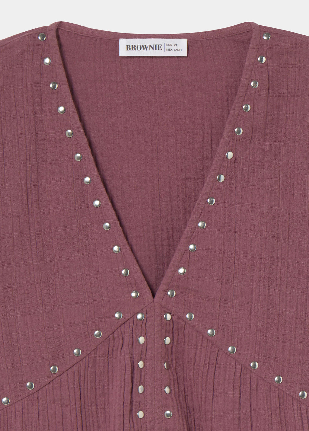 Blusa a maniche lunghe con borchie