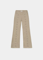Pantalón de talle alto en color arena con cordones decorativos en el frontal de cada pierna