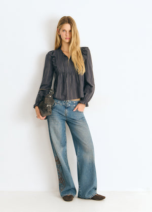 Blusa con volantini a righe lurex