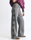 Jeans estrellas tachas lateral