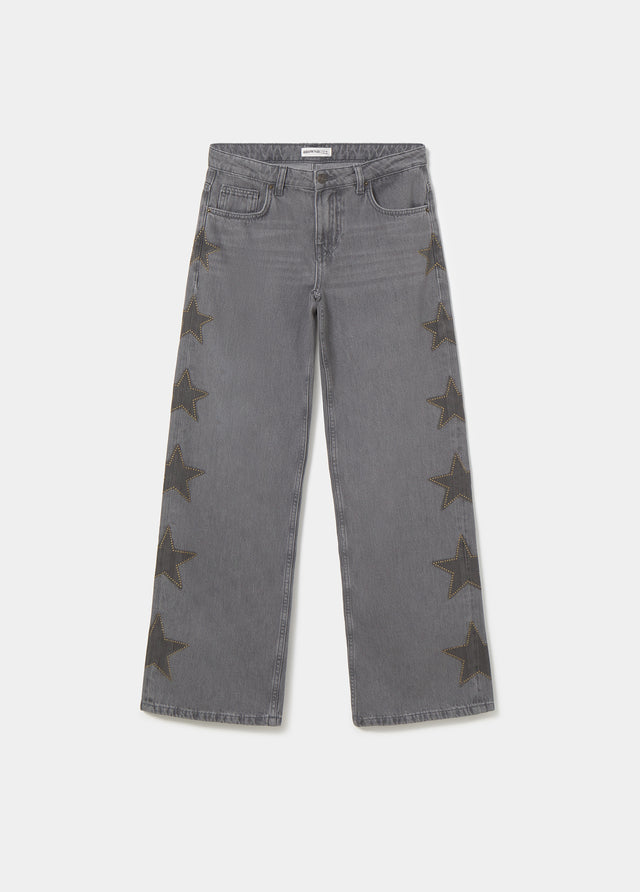 Jeans con stelle e borchie laterali