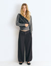 Pantaloni harem con cintura borchie