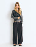 Pantaloni harem con cintura borchie