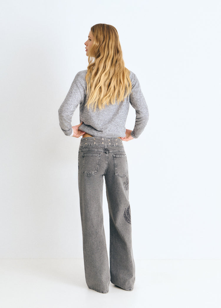 Jeans with a studded, embroidered waistband