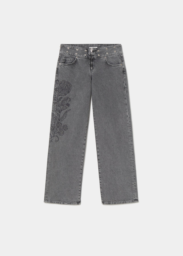 Jeans with a studded, embroidered waistband