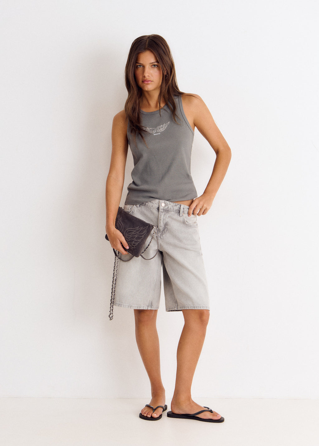 Bolso tachitas alas