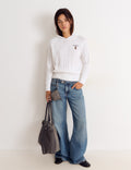 Zopfmuster-Pullover mit Stickerei