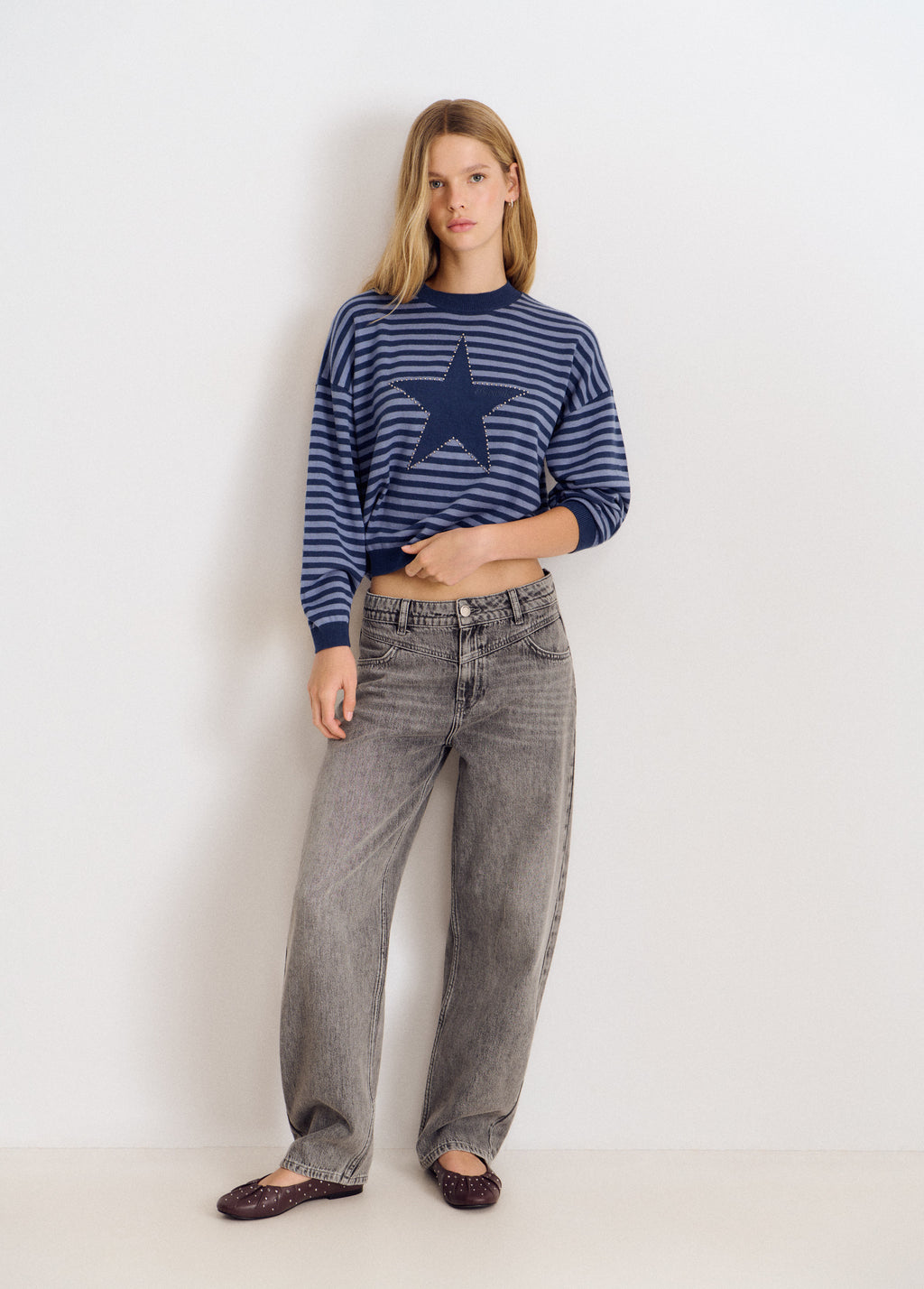 Maglione a righe con stella