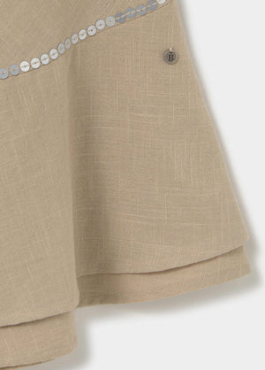 Short dress with asymmetrical hem and draped neckline