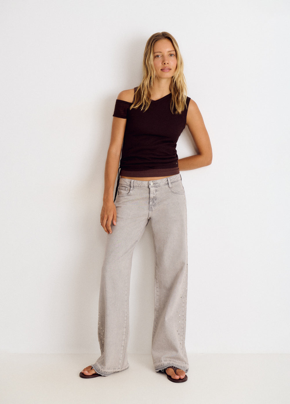 Jeans tachas laterales