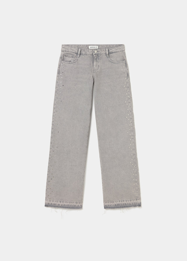 Jeans tachas laterales