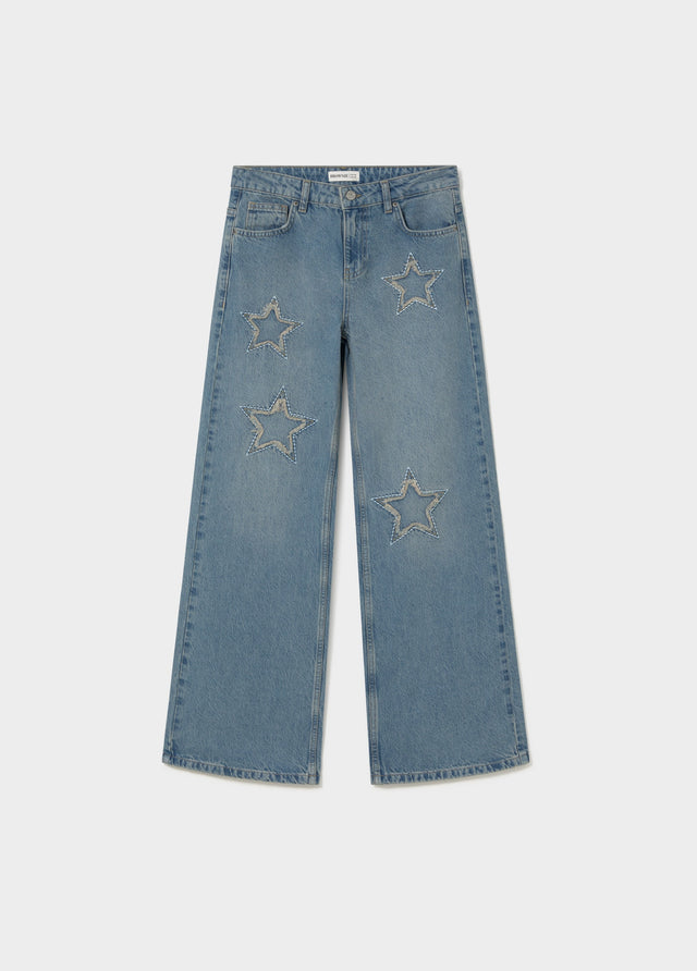 Jeans amb estrelles i pegat desfilat