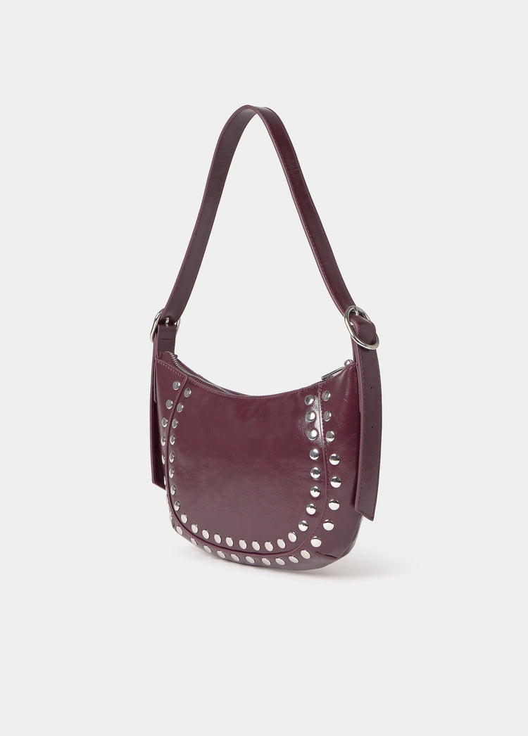 Bolso media luna tachas