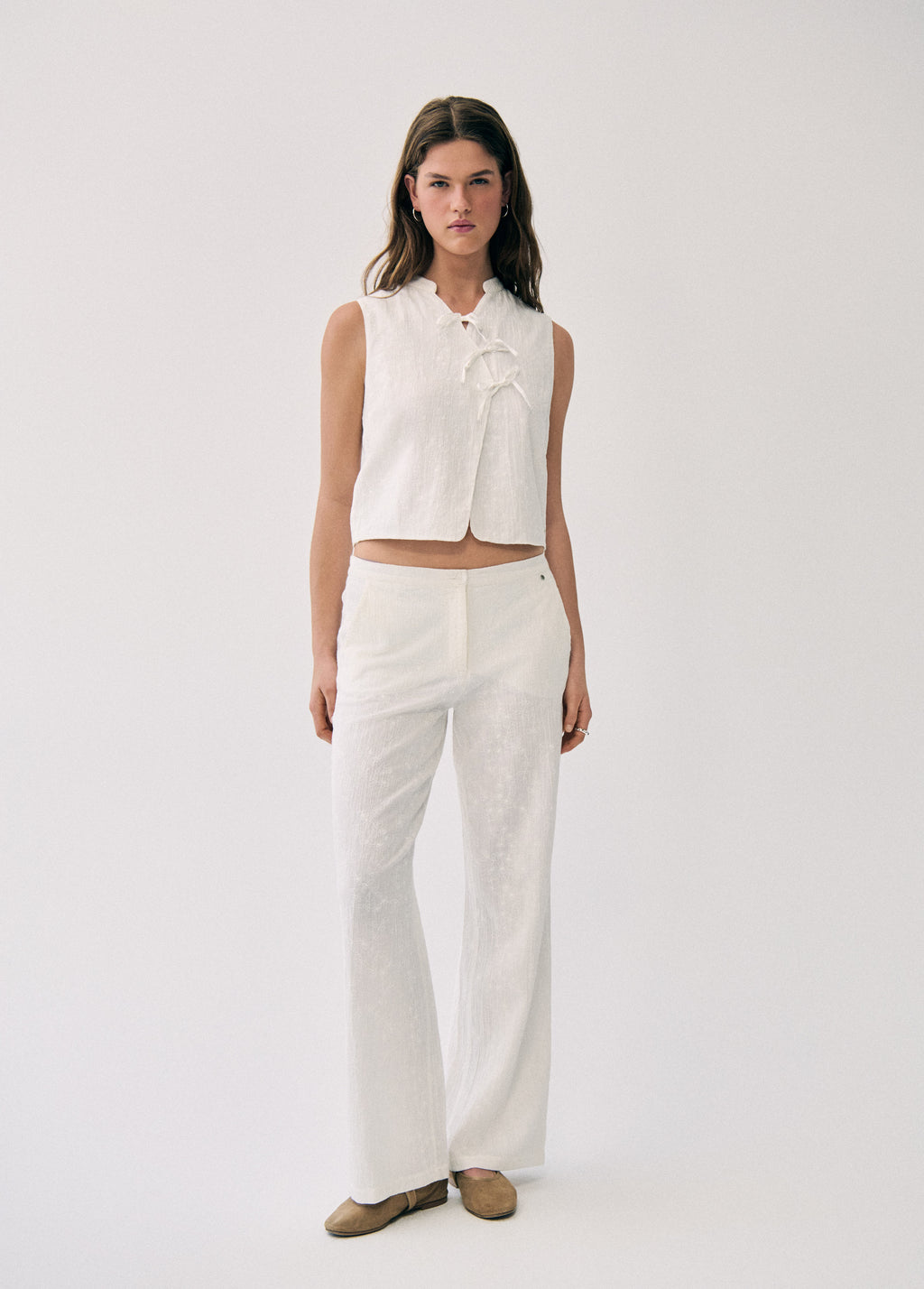 Embroidered knot vest