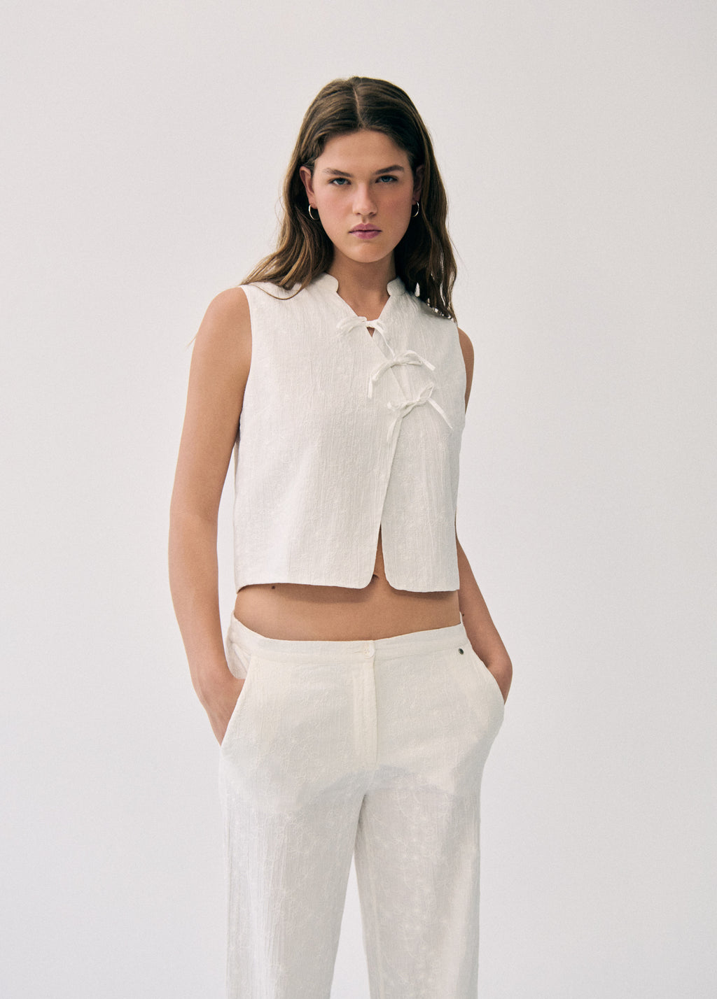 Embroidered knot vest