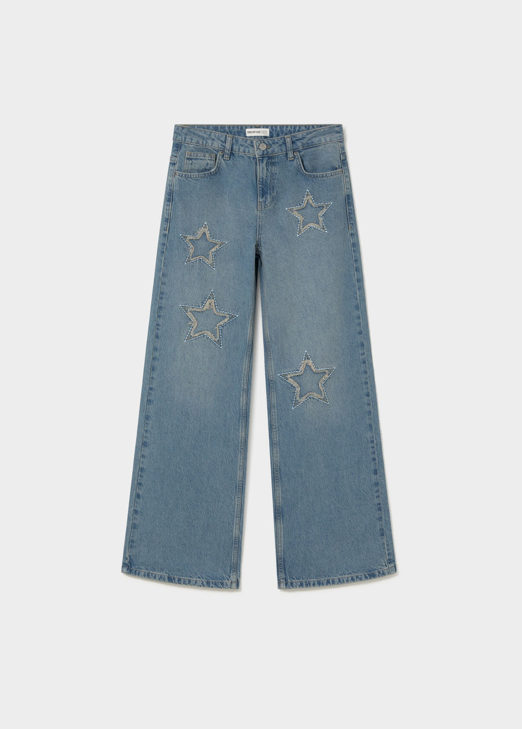 Jeans amb estrelles i pegat desfilat