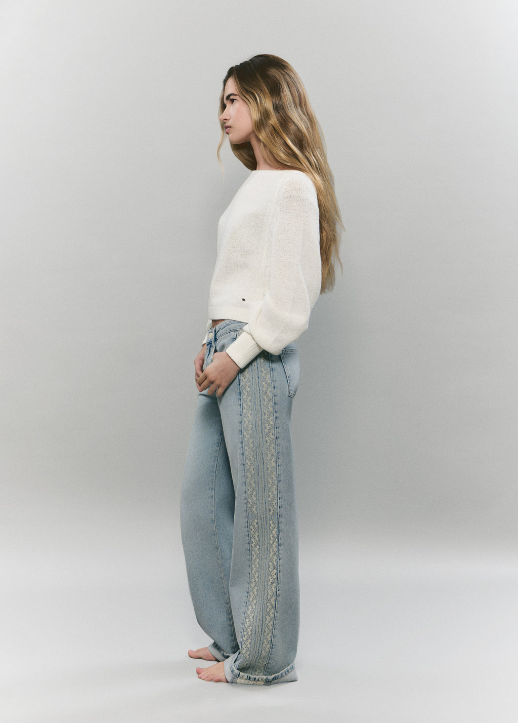 Jeans with side cross-stitch panel
