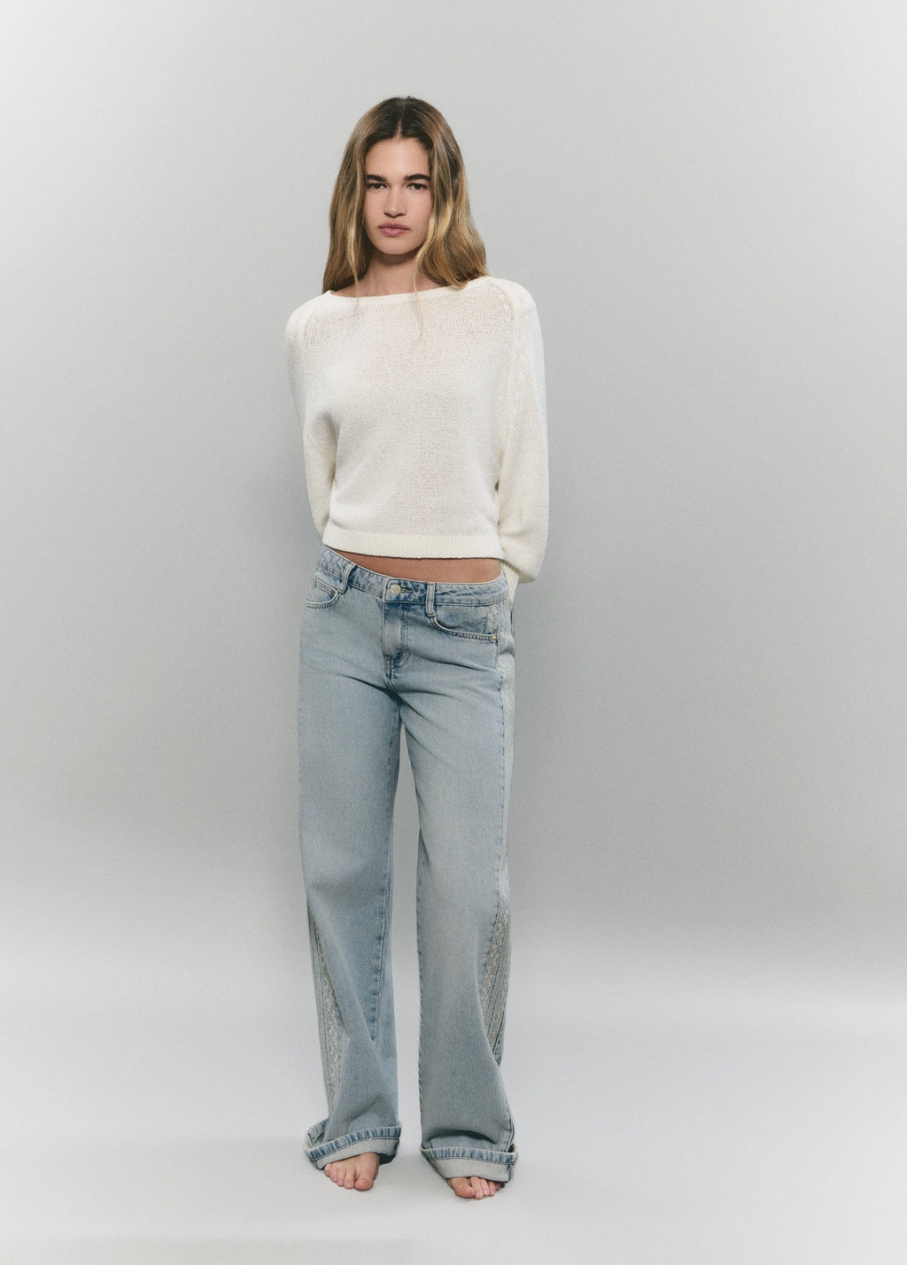 Jeans with side cross-stitch panel