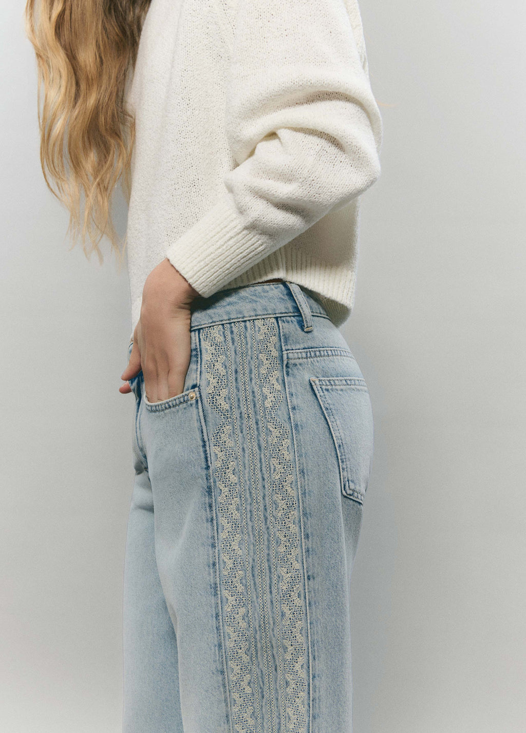 Jeans with side cross-stitch panel