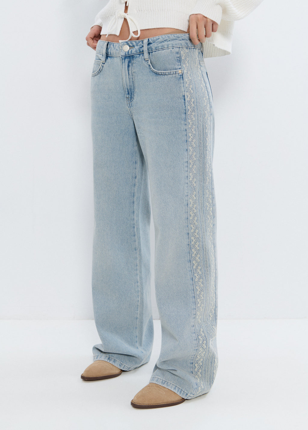Jeans with side cross-stitch panel