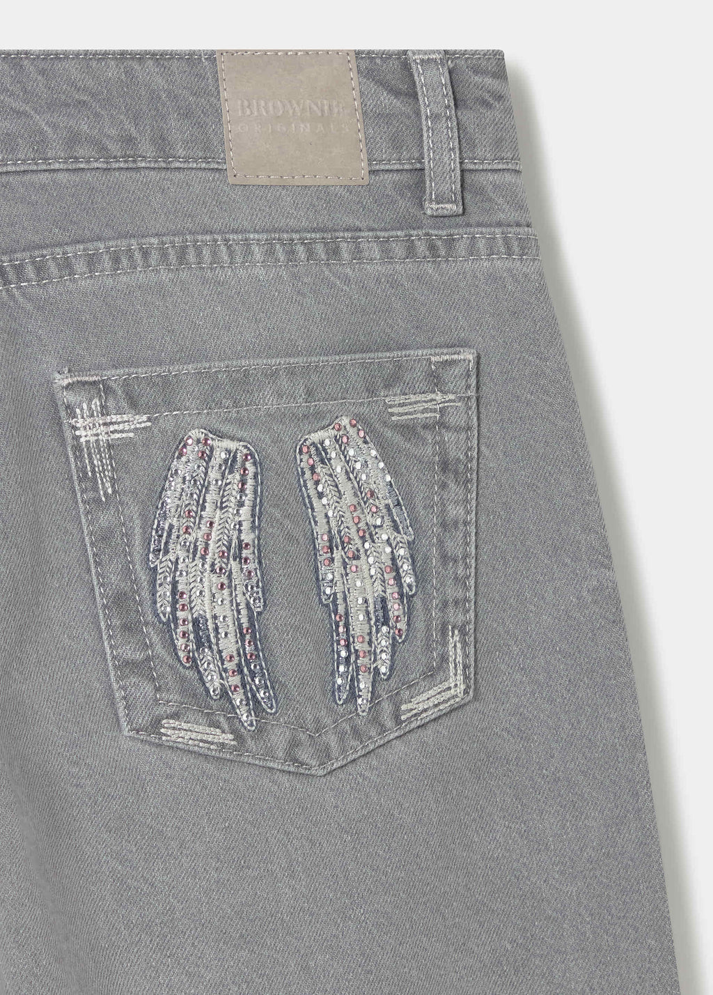 Jean taille basse ailes brodées et clous