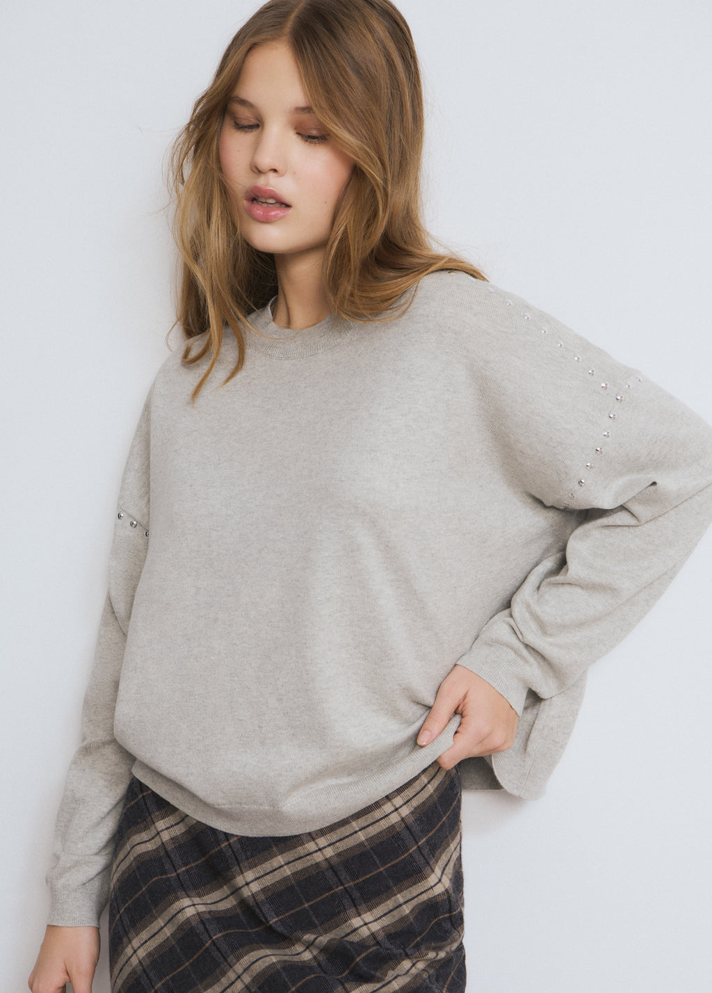 Maglione con borchie