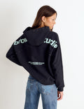 Sudadera capucha tachas
