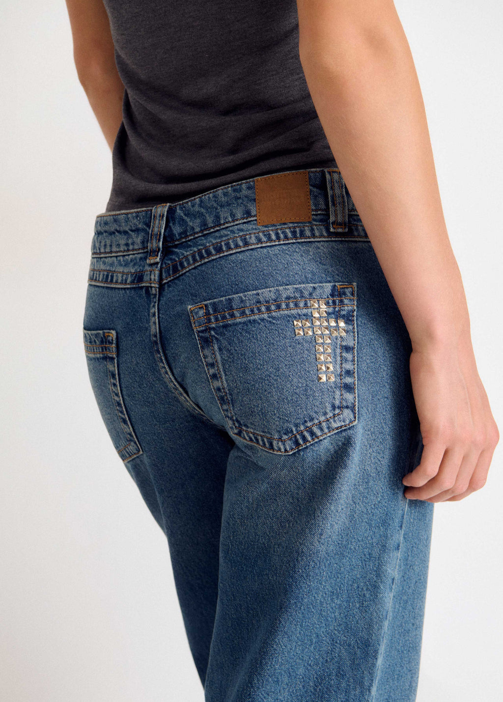 Denim with cross studs