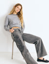 Jeans with a studded, embroidered waistband