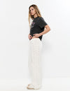 Pantalón pieza lateral tachuelas