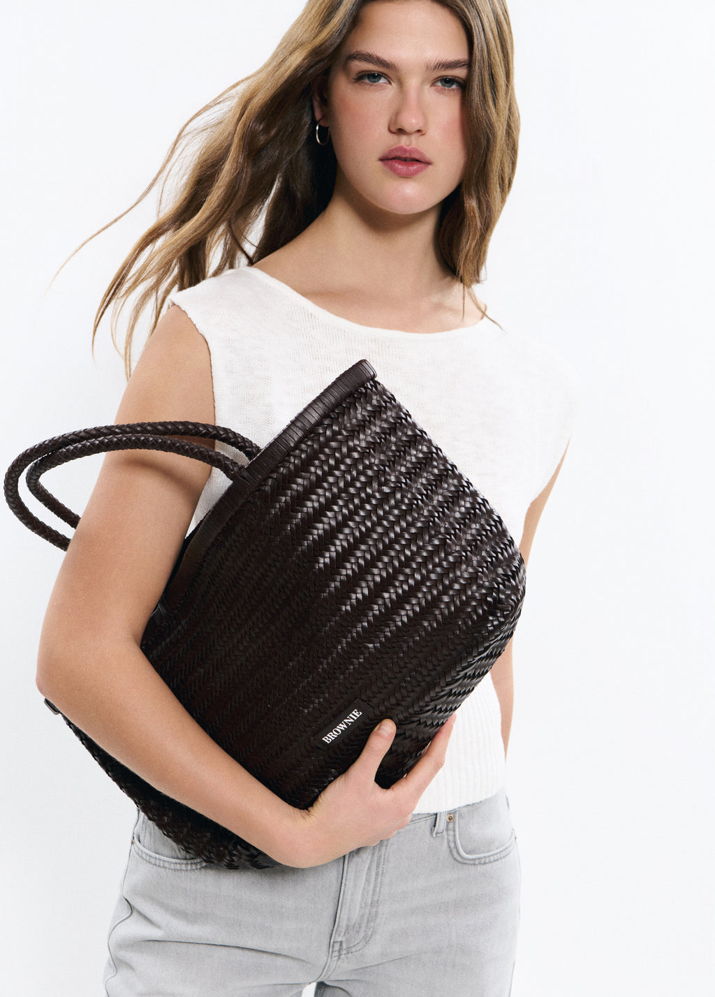 Mala shopper trançada em pele