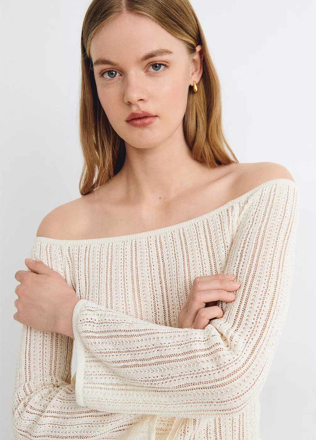 Open-knit cold-shoulder jumper